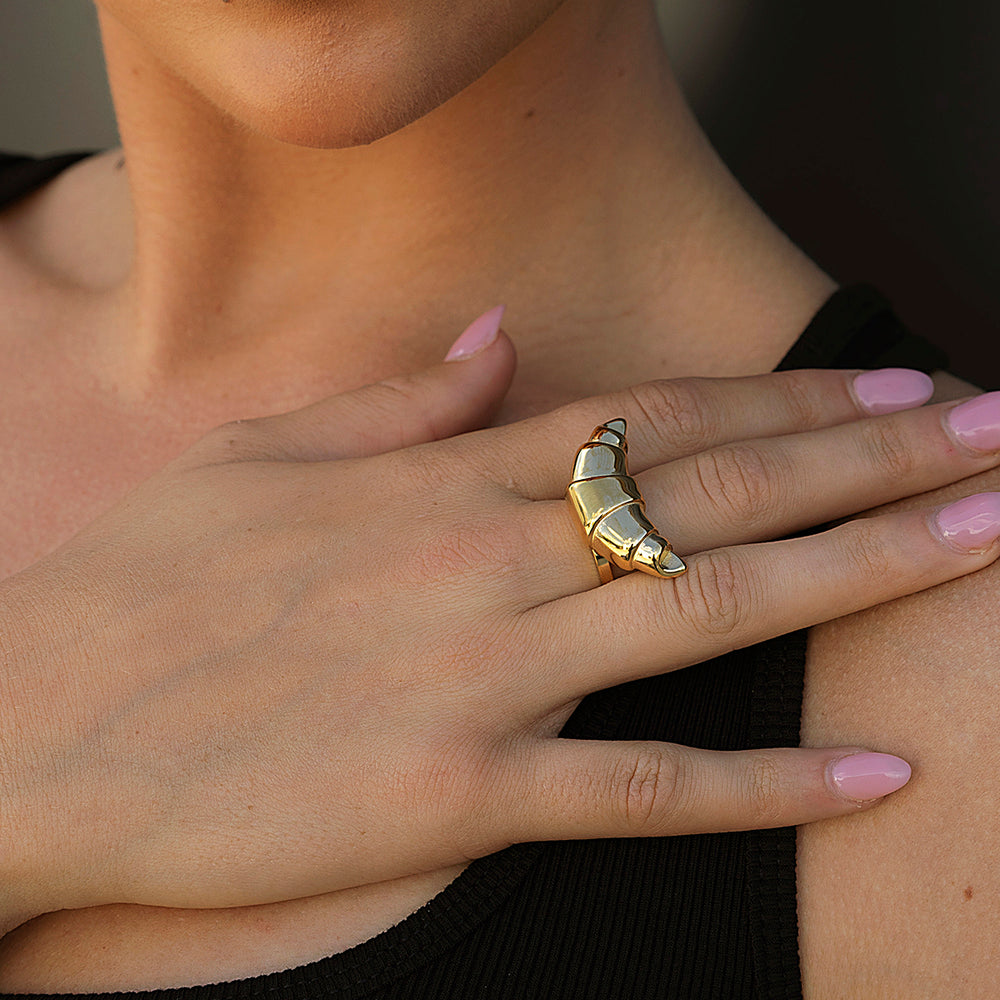 Gold sculpted croissant ring on hand – bold textured gold statement ring inspired by pastry