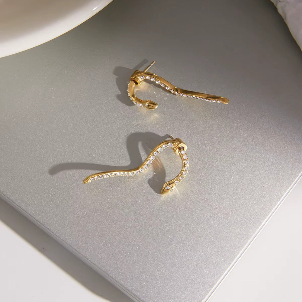 Snake Waves – gold earrings with cubic zirconia stones