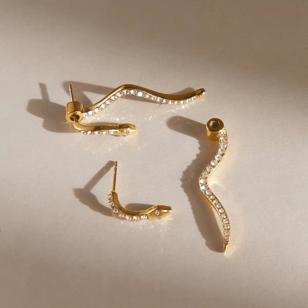 Snake Waves – gold earrings with cubic zirconia stones