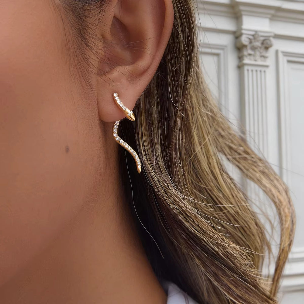 Snake Waves – gold earrings with cubic zirconia stones