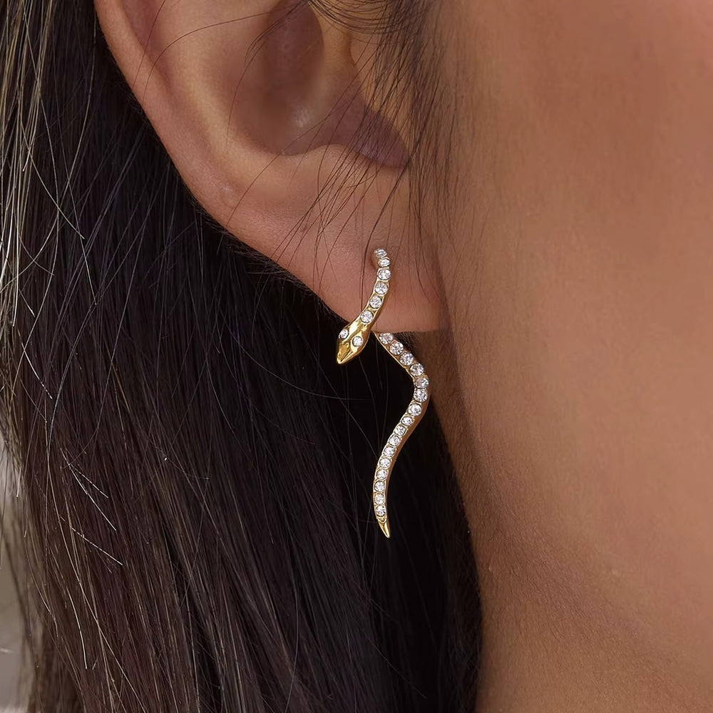 Snake Waves – gold earrings with cubic zirconia stones