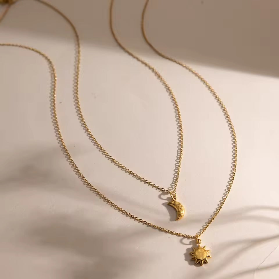 Celestial Duo Necklace – double-layered gold necklace with crescent moon and sun pendant