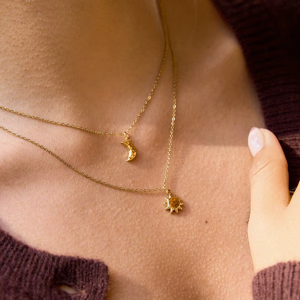 Celestial Duo Necklace – double-layered gold necklace with crescent moon and sun pendant