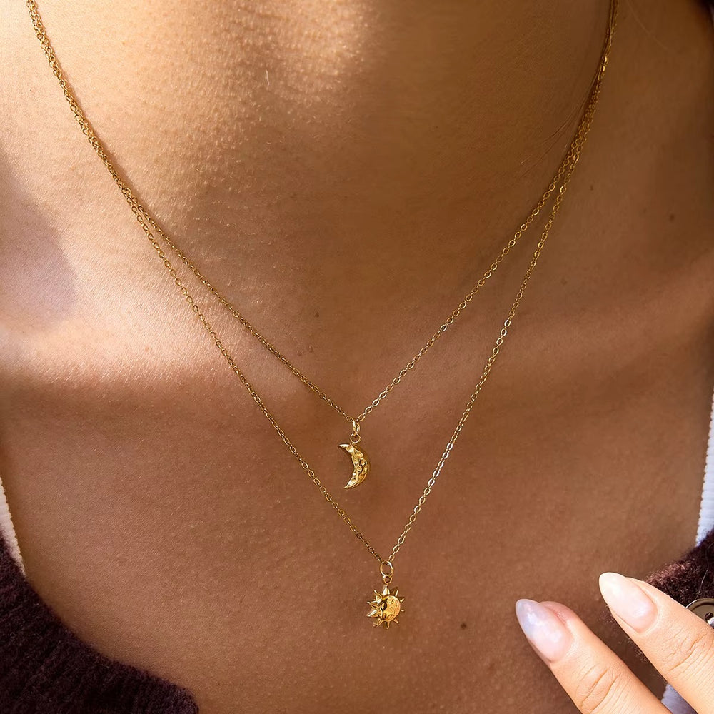 Celestial Duo Necklace – double-layered gold necklace with crescent moon and sun pendant