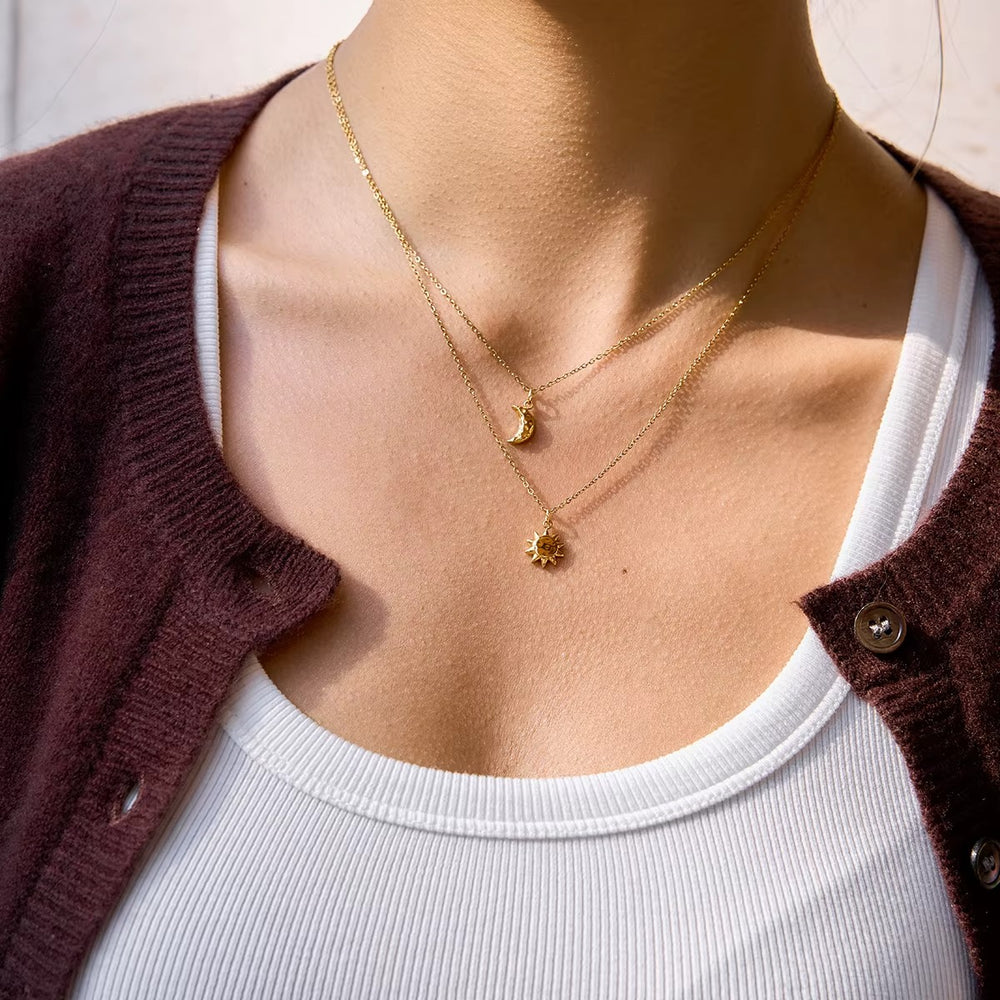 Celestial Duo Necklace – double-layered gold necklace with crescent moon and sun pendant