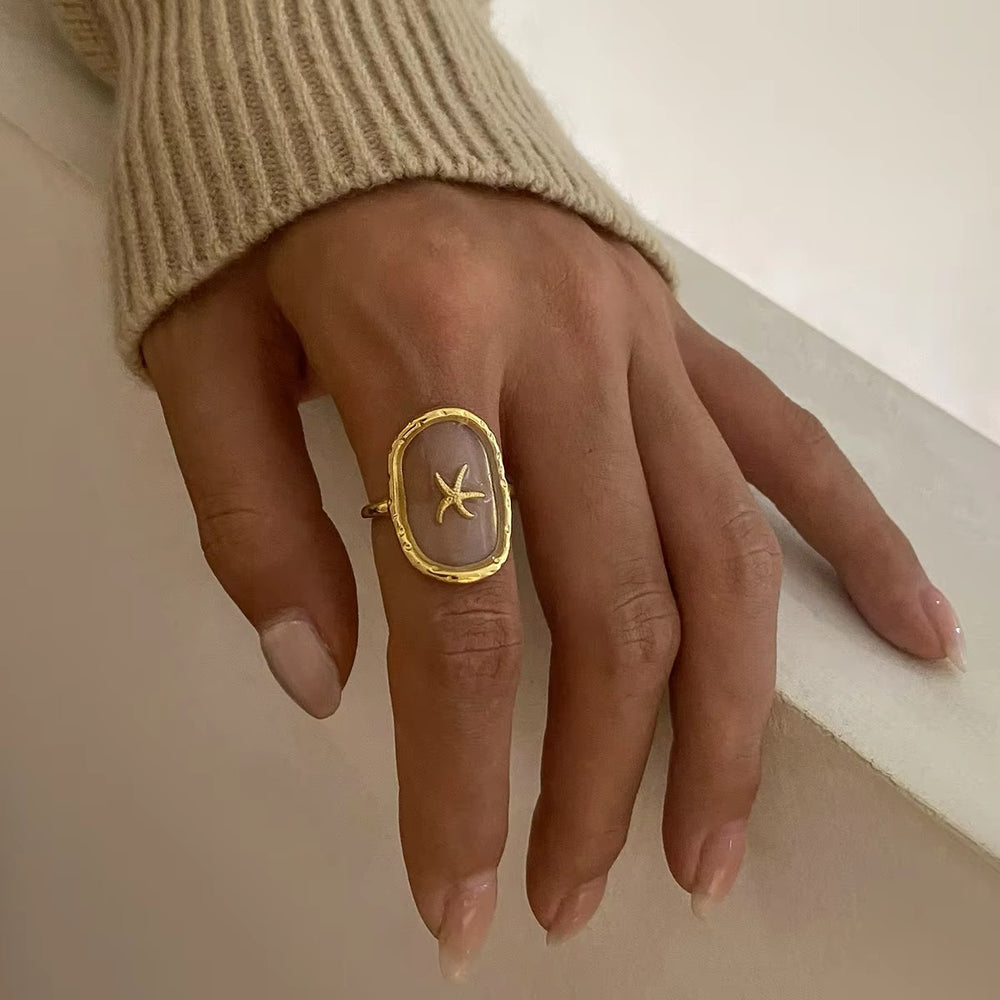 Stella – Starfish Ring – adjustable gold starfish ring with lilac base