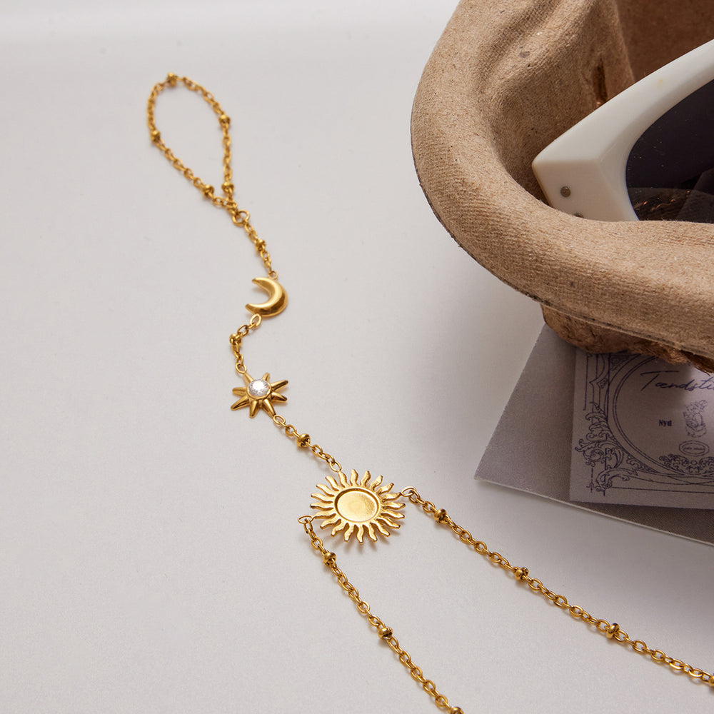 Celestial Chain Bracelet – gold hand chain with sun, moon and star charms