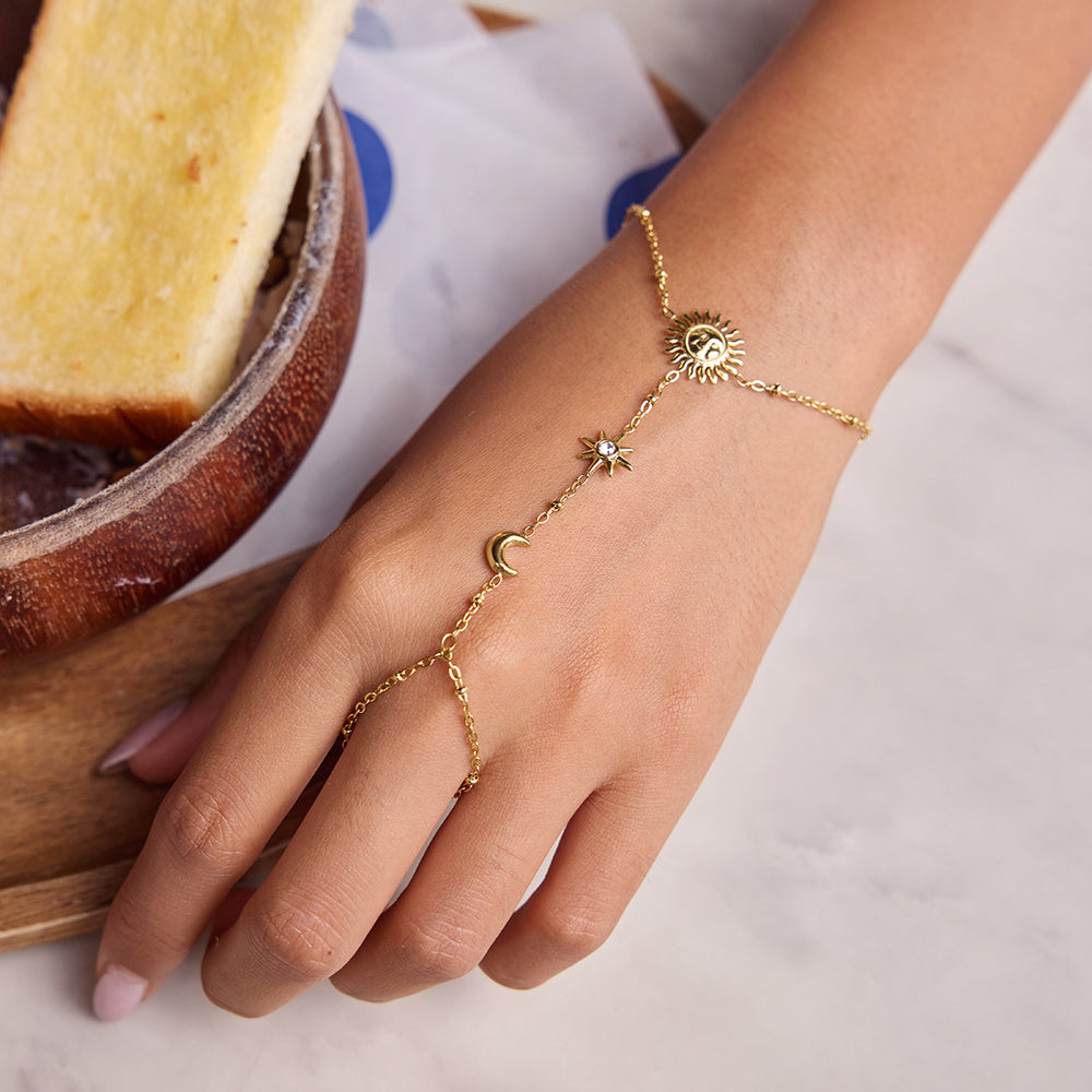Celestial Chain Bracelet – gold hand chain with sun, moon and star charms